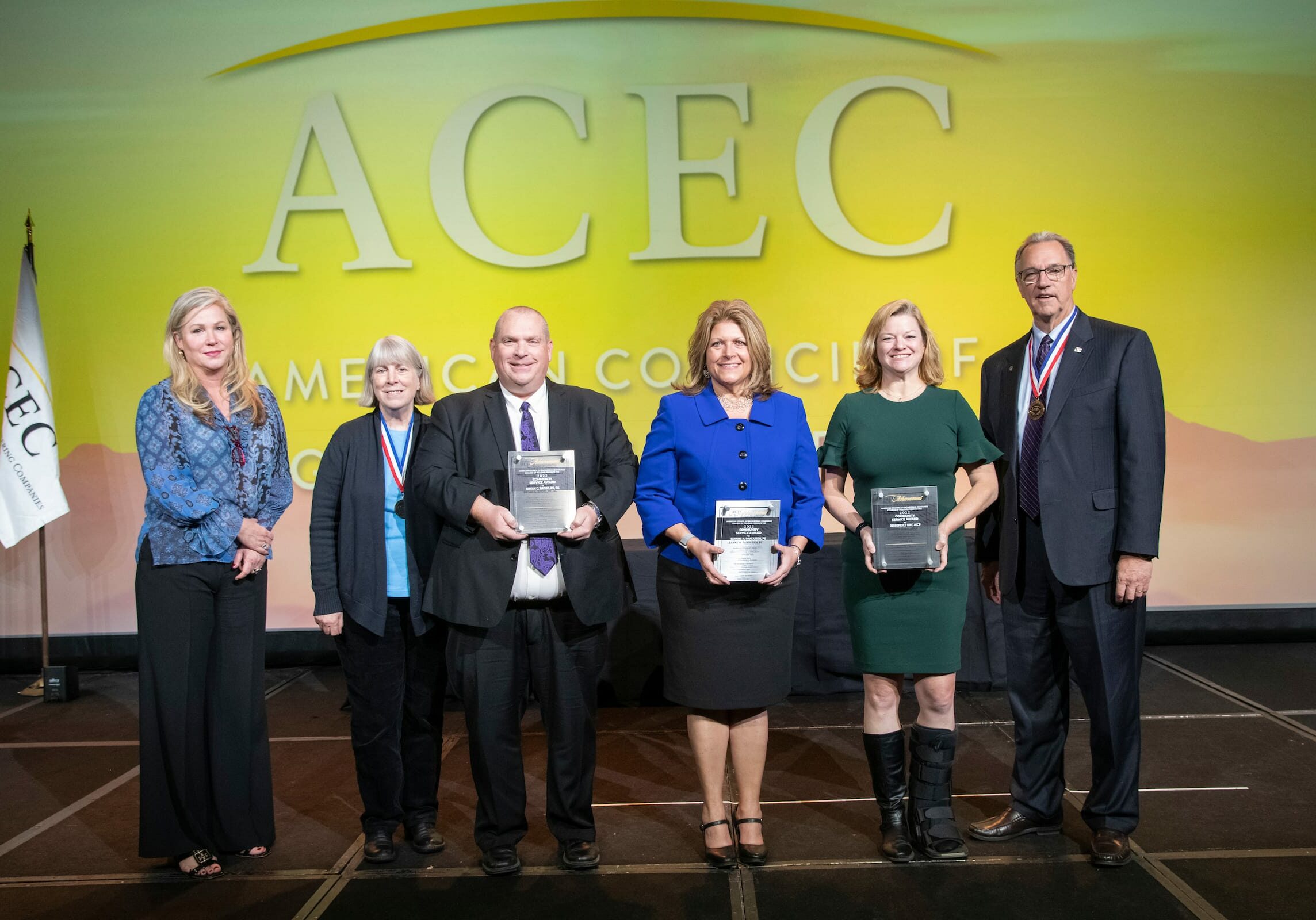 acec members standing on stage during awarding