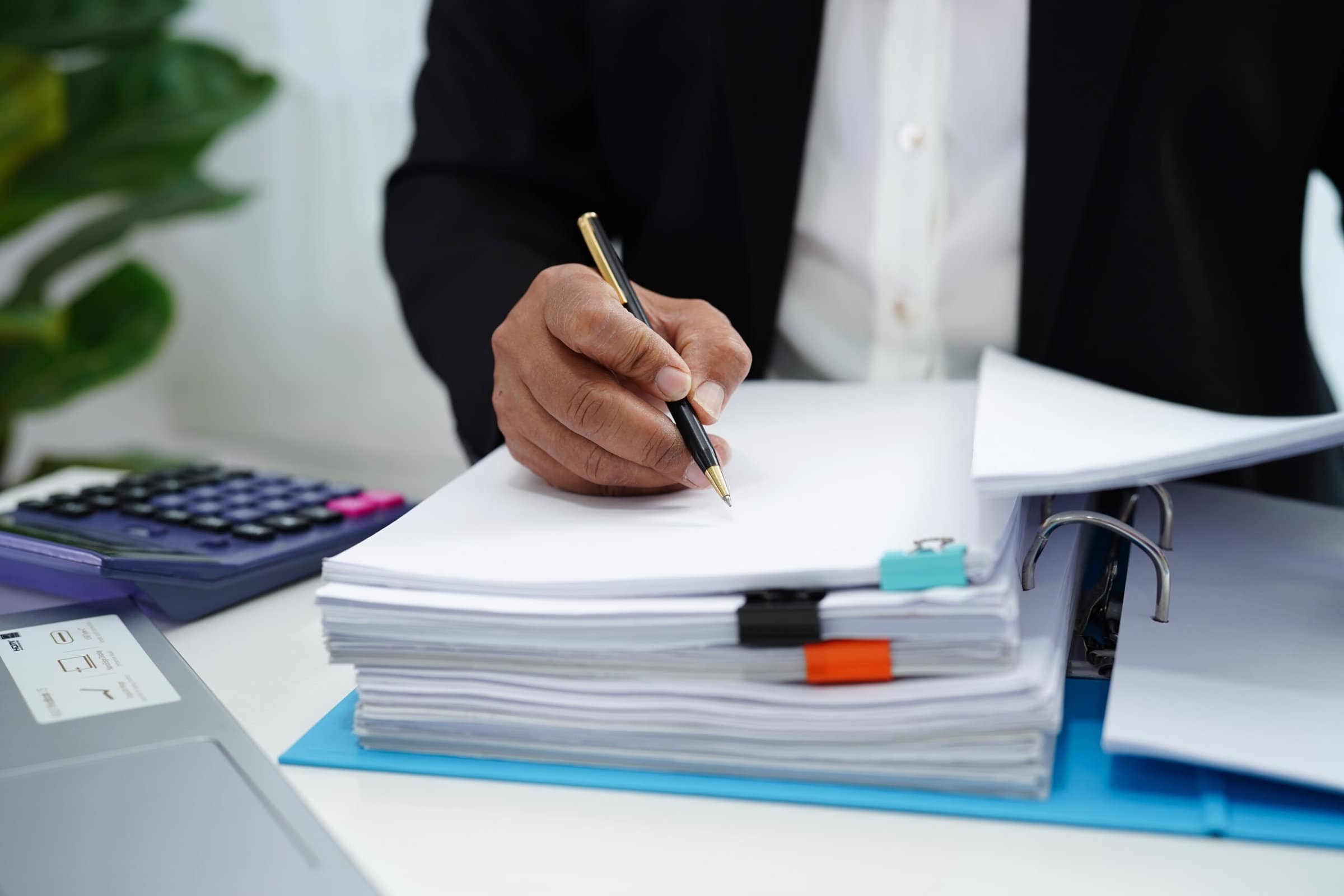 Business woman busy working with documents in office.