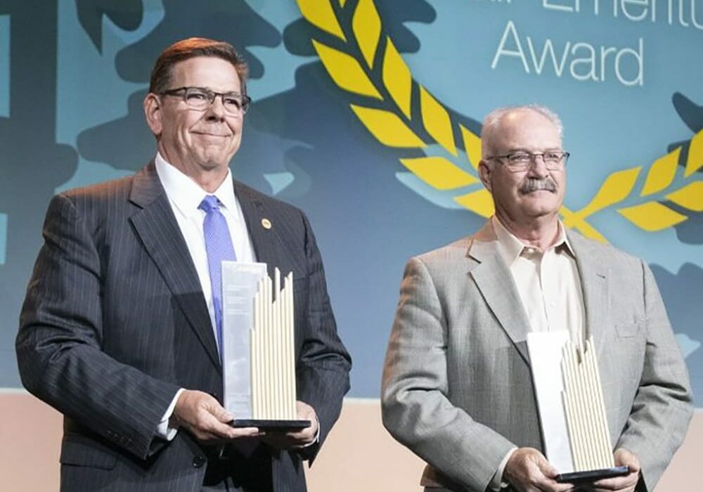 ACEC Members holding the Chair Emeritus Award trophy