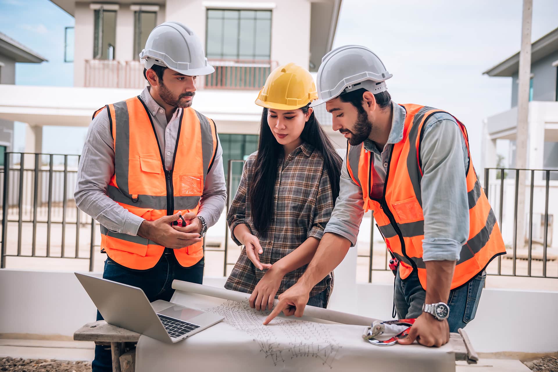 civil-engineer-construction-worker-architects-wearing-hardhats-safety-vests-are-working-together-construction-site-building-home-cooperation-teamwork-concept