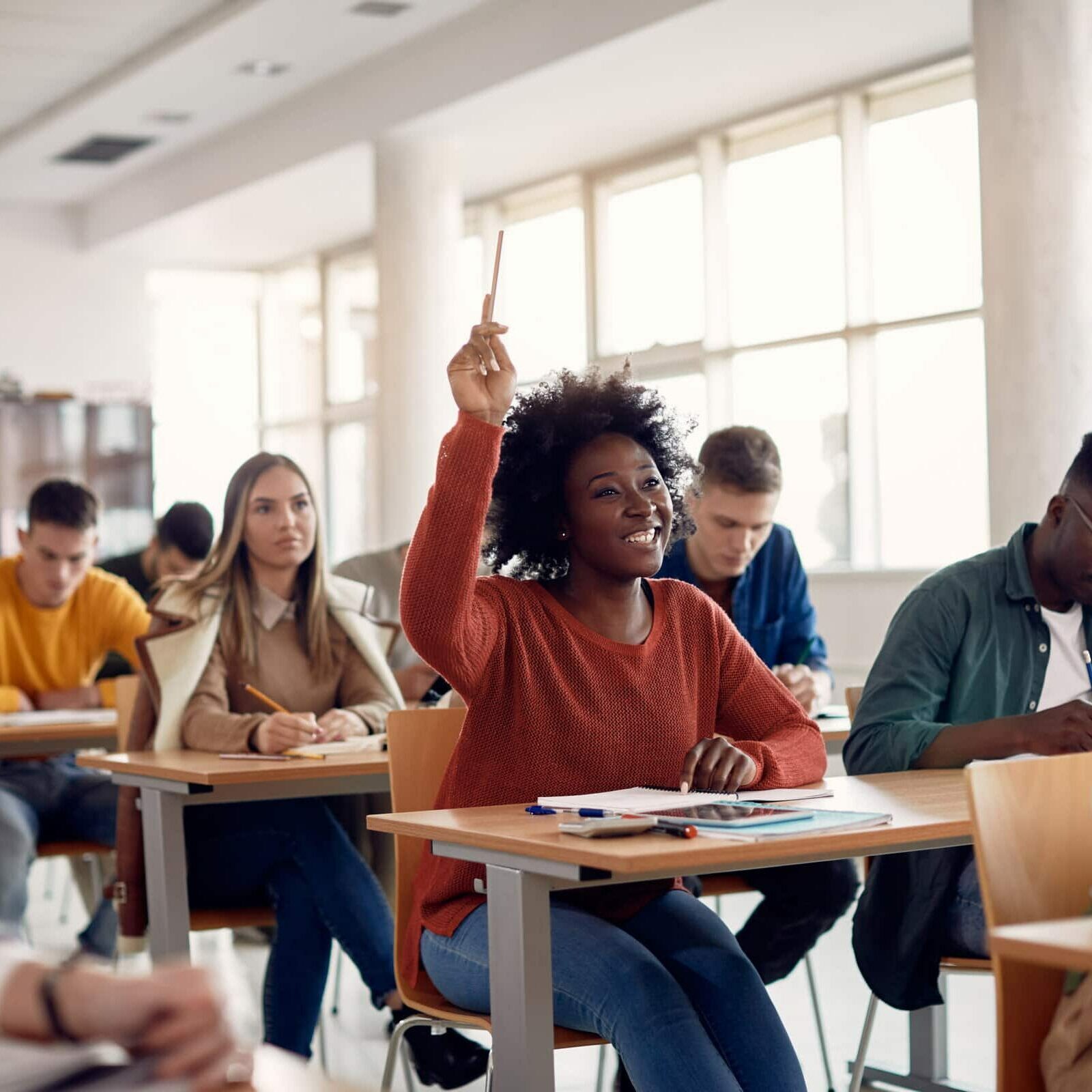 Happy African American Student Raising Her Hand To Ask