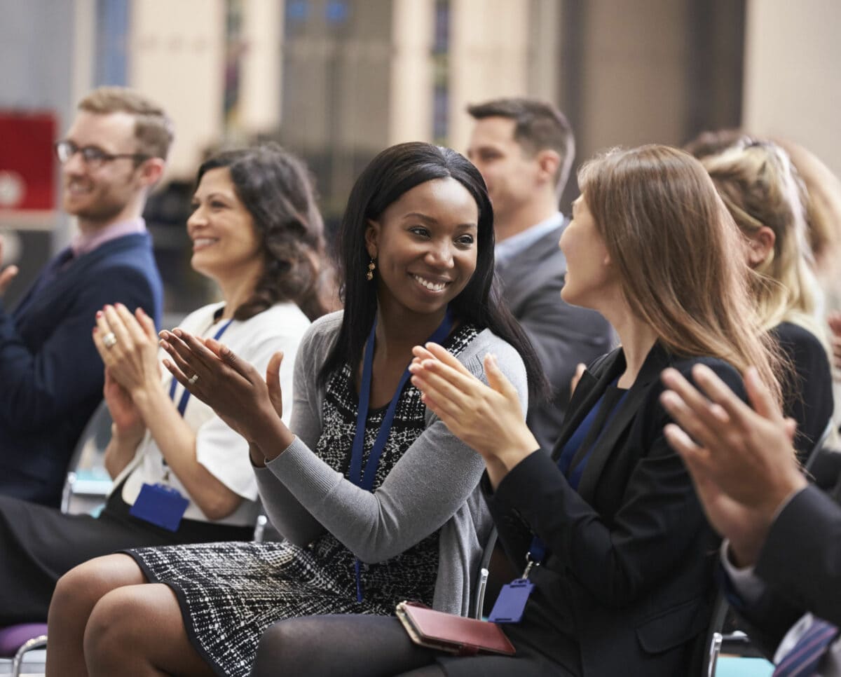 diverse group of audience clapping during an event