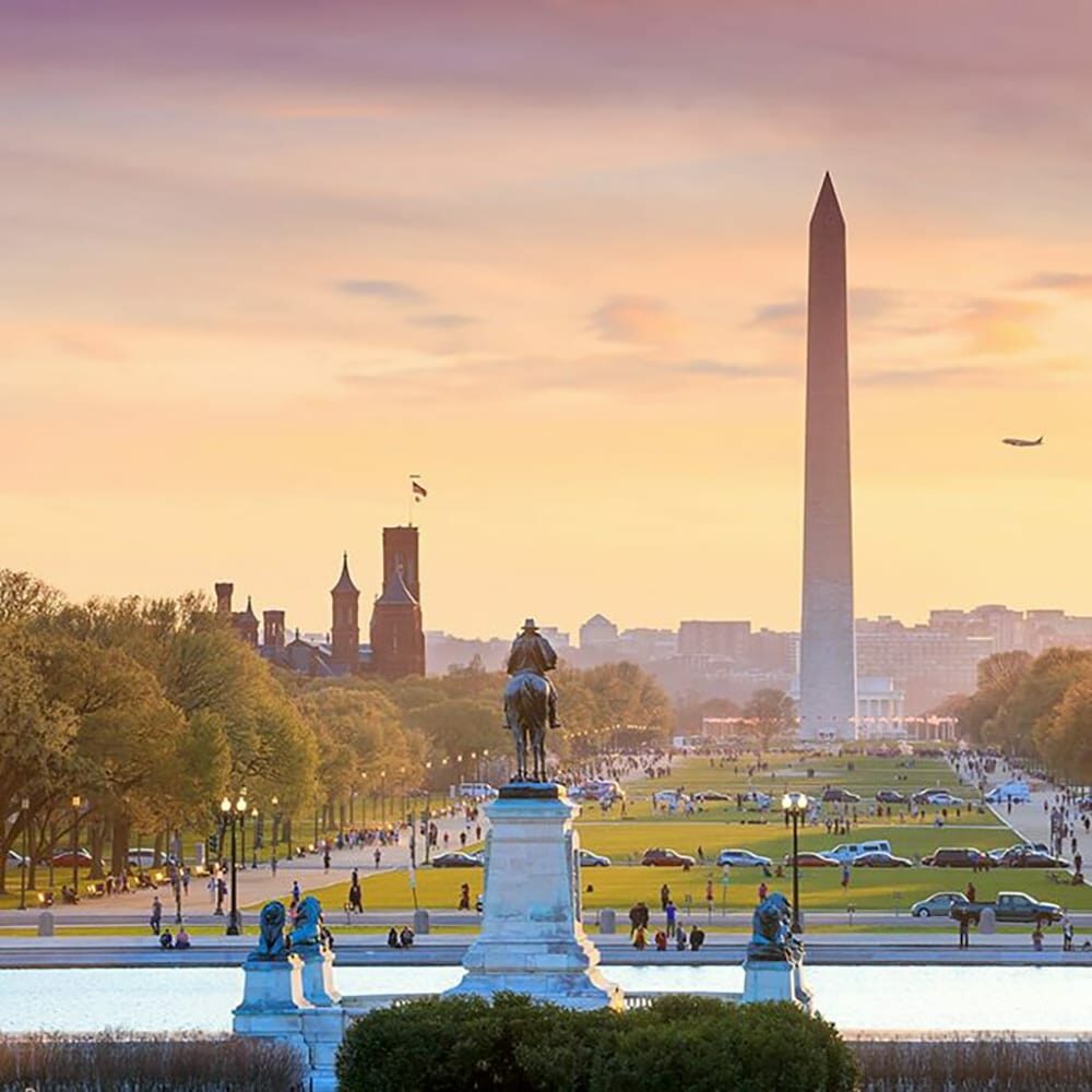 Washington dc city view orange sunset including Washington monument from capitol building